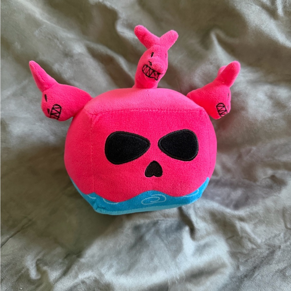 Pink and Blue Plush Toy with Skulls